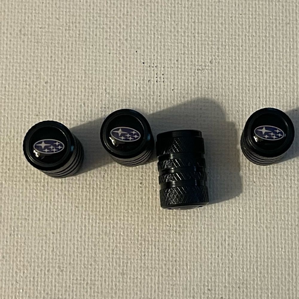 Subaru logo valve Stem caps in black set of 4 NWT